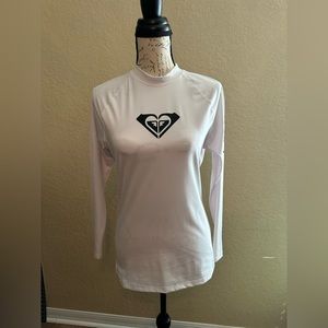 Roxy Women's hearted Long Sleeve shirt. Shirt runs small. Never worn.